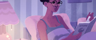 girl with bantu knots lying in bed, reading from book with sex positive logo on cover and FC2 condom on nightstand