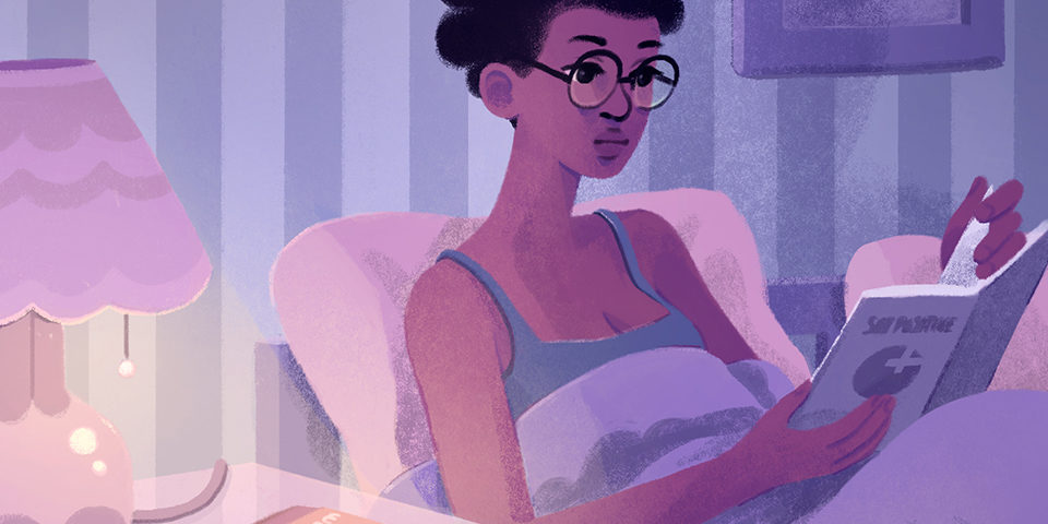 girl with bantu knots lying in bed, reading from book with sex positive logo on cover and FC2 condom on nightstand