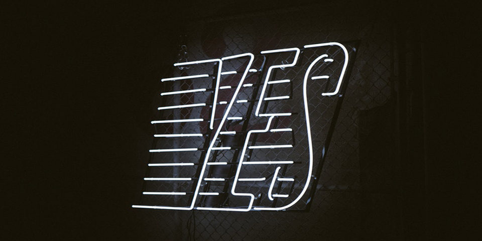 White Neon "Yes" with lines on black background