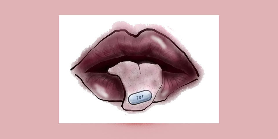 mouth slightly open with tongue hanging out, pill on top of tongue