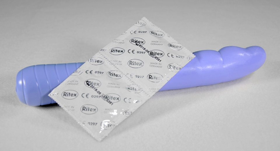 light blue dildo with white condoms