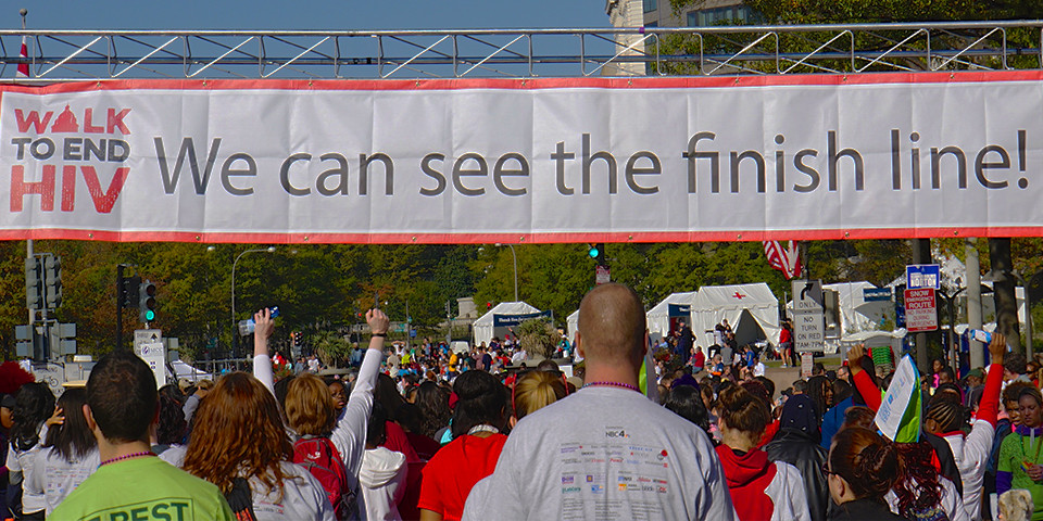 crowd cheers as they reach finish line of Whitman Walker's Walk to End HIV in Washington DC