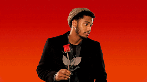 trey songz holding rose in front of red and orange background with white text overlay: "Sup Girl?"